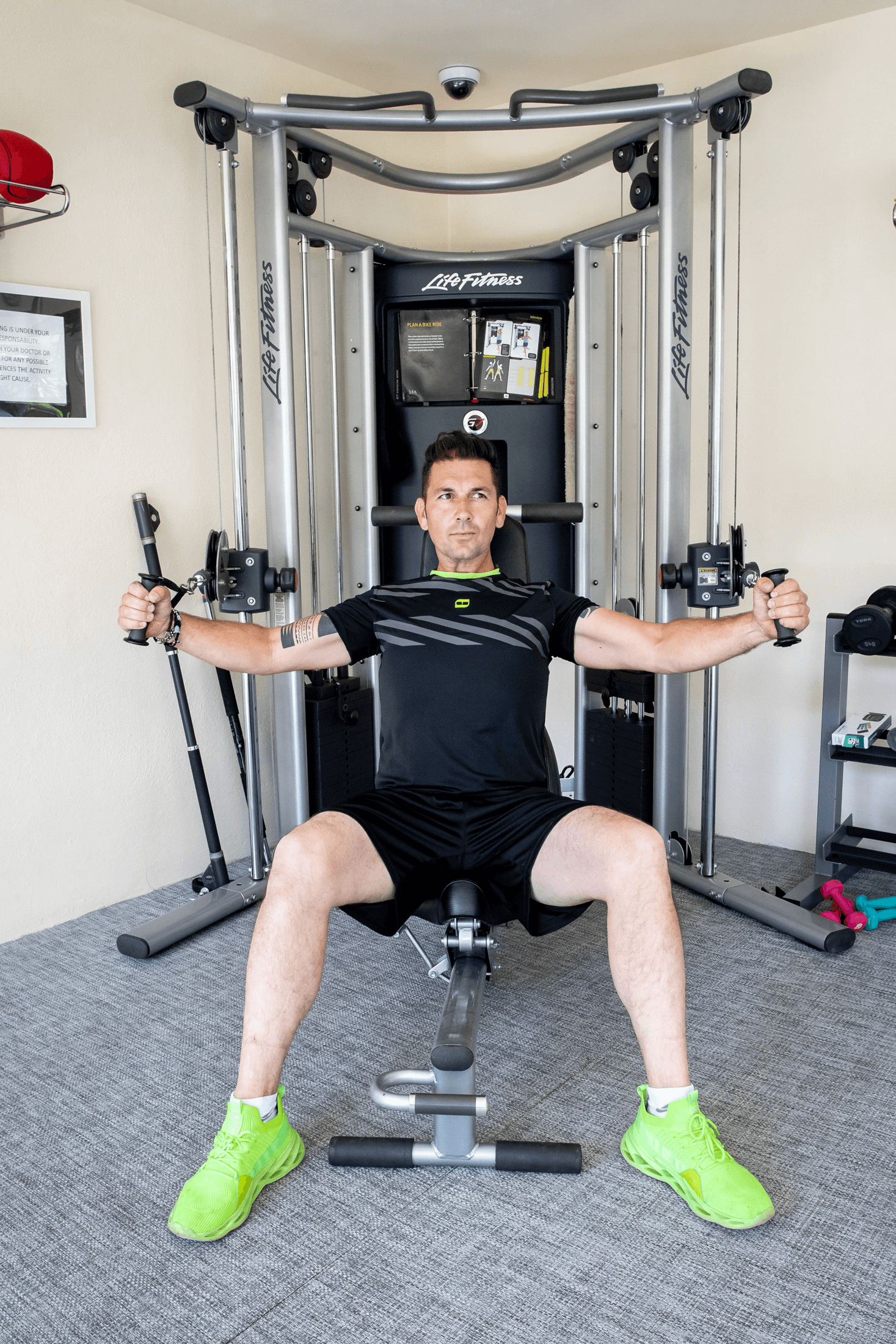 man in gym using equipment