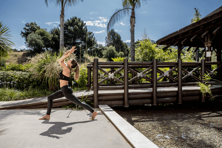 girl doing yoga in nature spain