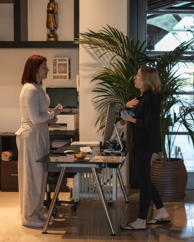 Member of the wellness team welcoming a guest at Shanti-Som